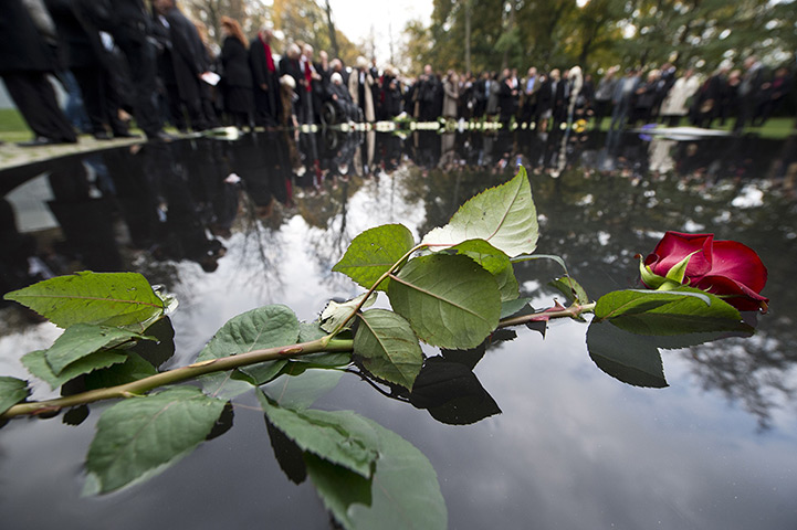 24 hours: Berlin, Germany: A rose lies on a memorial