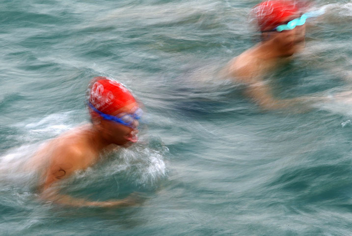 best of the week: Swimmers take part in the 1.5 kilometre Victoria Harbour race in Hong Kong