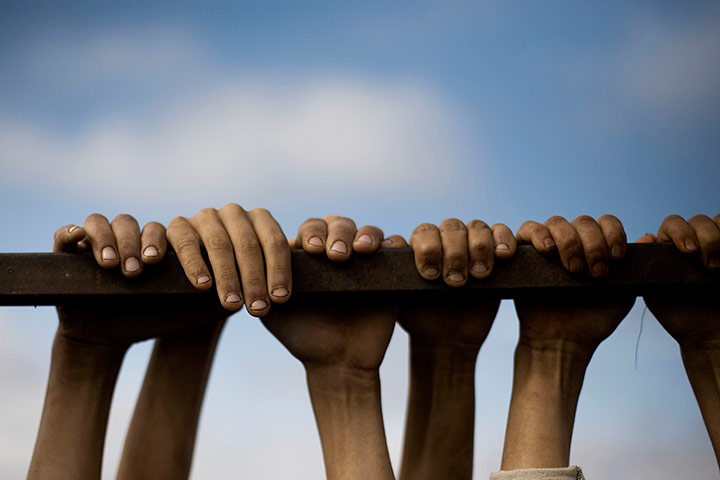 20 Photographs: Displaced children play in a refugee camp near Atma in Syria