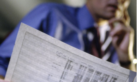 Businessman holding spreadsheet