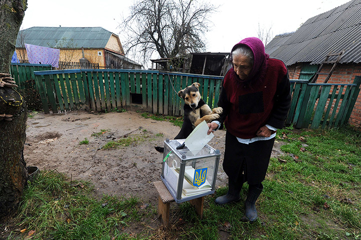 24 hours: Rusaki, Ukraine: An elderly woman casts her ballot