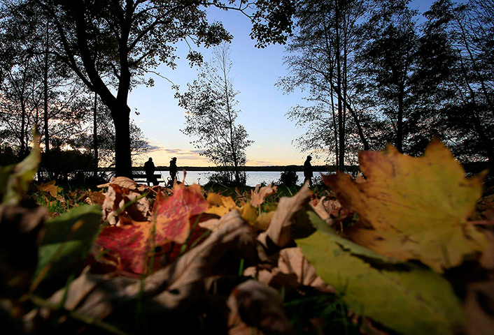24 hours: Berlin, Germany: People stroll along the shore of lake Tegel 