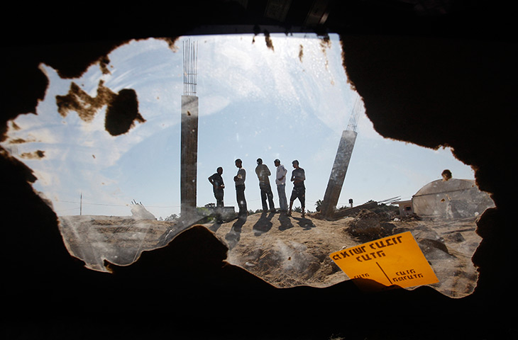 24 hours: Bureij refugee camp, Gaza Strip: Palestinians look at damage