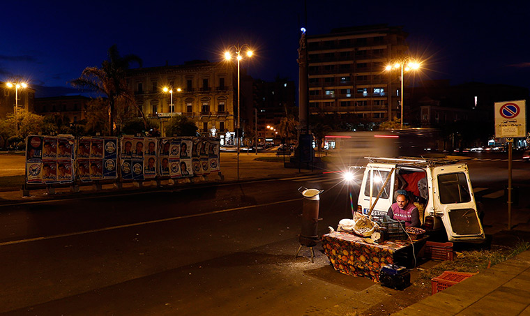 24 hours: Catania, Sicily, Italy: A chestnut seller 