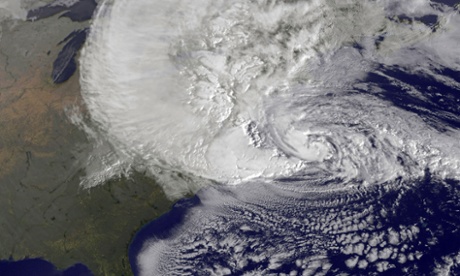A dramatic satellite image provided by NASA: Hurricane Sandy, pictured at 1240, churns off the east coast in the Atlantic Ocean.