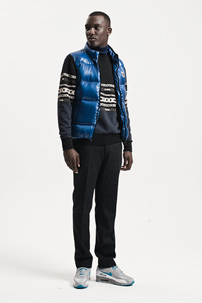 All Ages: Blue: Model wears blue gilet with navy sweatshirt and navy trousers