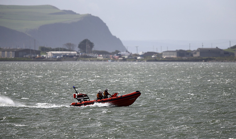 April Jones day 2: A RNLI lifeboat patrols water close to Machnylleth