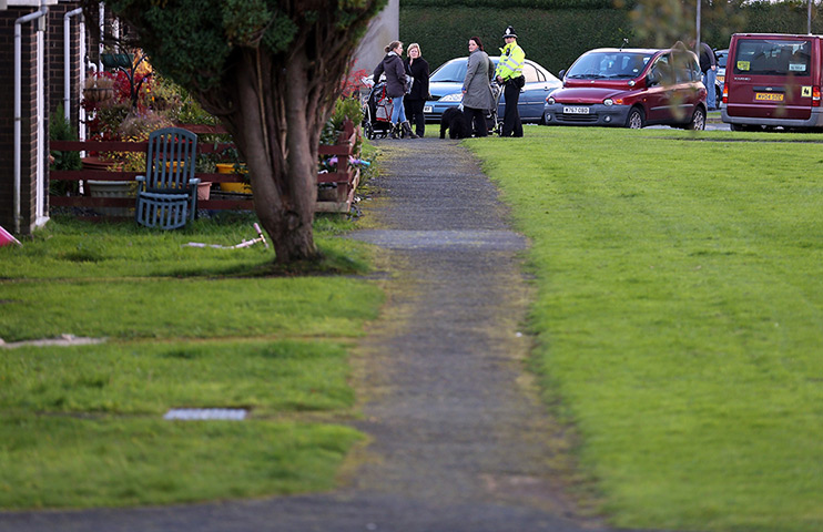 April Jones day 2: People walk past the home of missing child April Jones