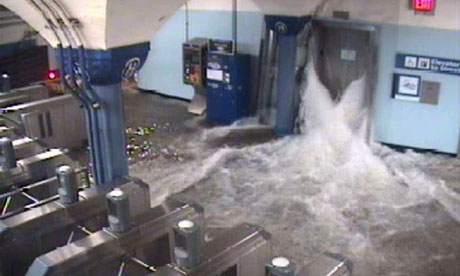 Floodwaters from hurricane Sandy rush down an elevator shaft into Hoboken subway station in New York
