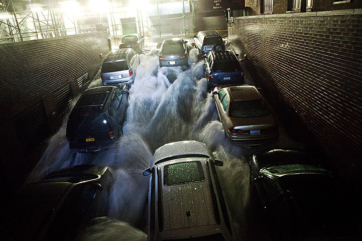 Sandy hits New York: Rising water rushes into an underground parking garage