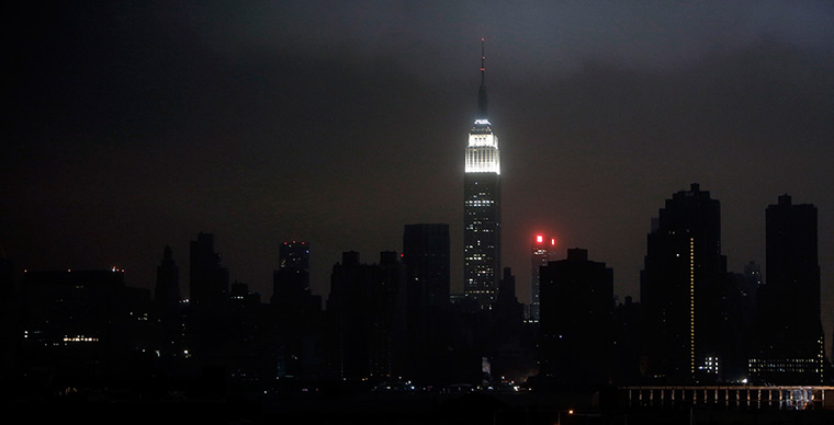 Sandy hits New York: A blacked out New York City skyline 