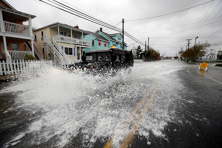 Sandy on east coast: A National Guard humvee travels through flood water in Ocean City, Maryland