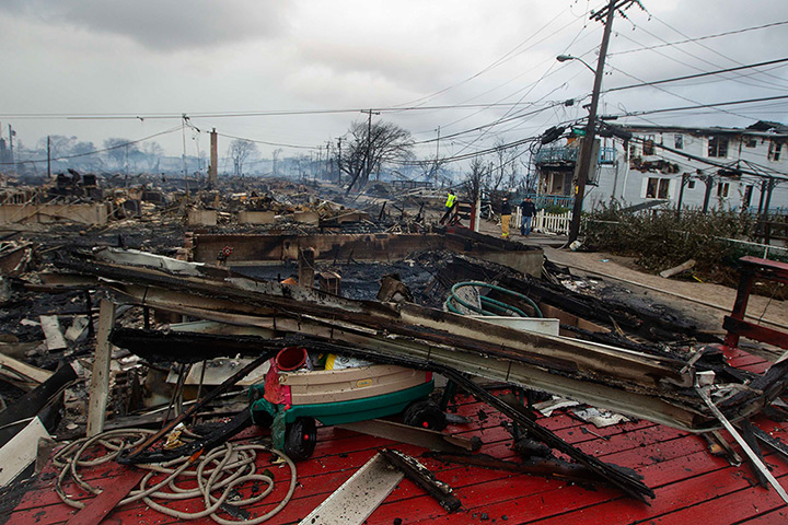 Sandy on east coast: Homes devastated by fire at the Breezy Point section 