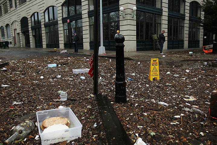 Sandy on east coast: Debris litter a flooded street in the Dumbo sector of Brooklyn