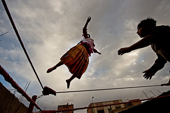 Cholitas: Yolanda La Amorosa takes to the air during a training session