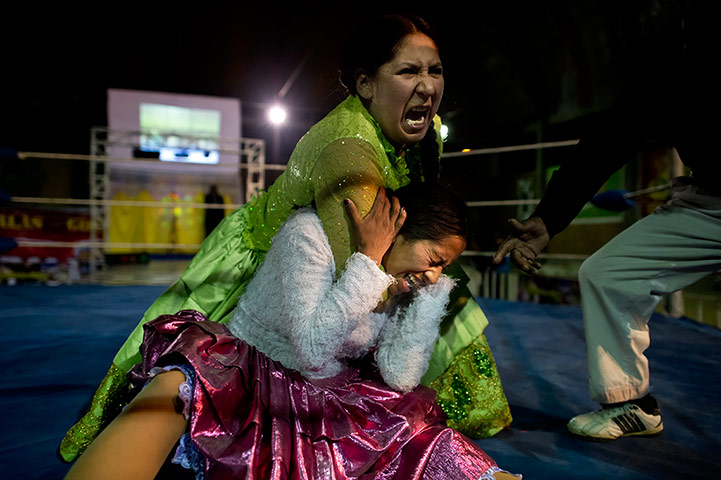 Cholitas: Martha puts Denita into a rear naked choke during their fight