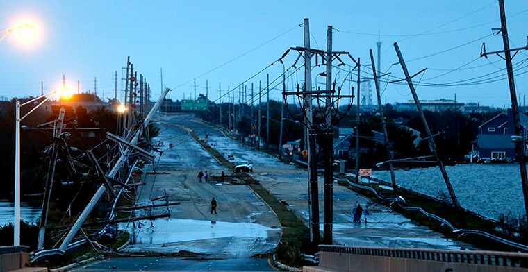Coastal aftermath: Downed power lines and a battered road off Seaside Heights island