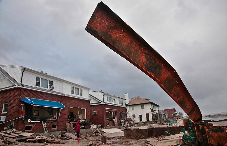 Coastal aftermath: A steel reinforcement is ripped from a metal sea wall 
