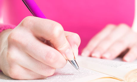 Young woman with pen