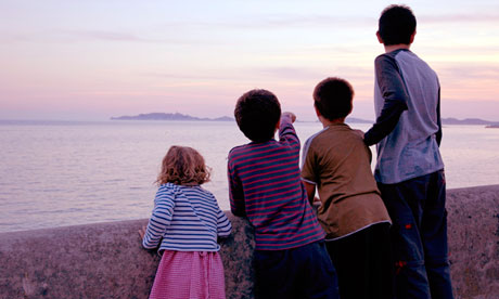 Four children watching the sunset 