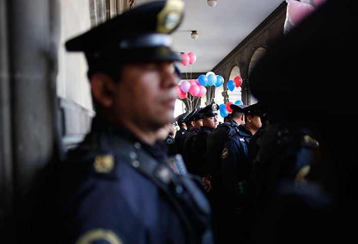 24 hours in pictures: Police guard the entrance to the Federal District Government building
