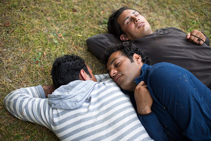 20 Photographs: Iranian refugees sleep during a break in a protest march through Germany