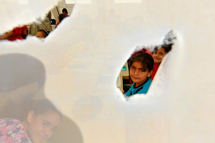 20 Photographs: Syrian child refugees attend school at al-Zaatri refugee camp, Jordan