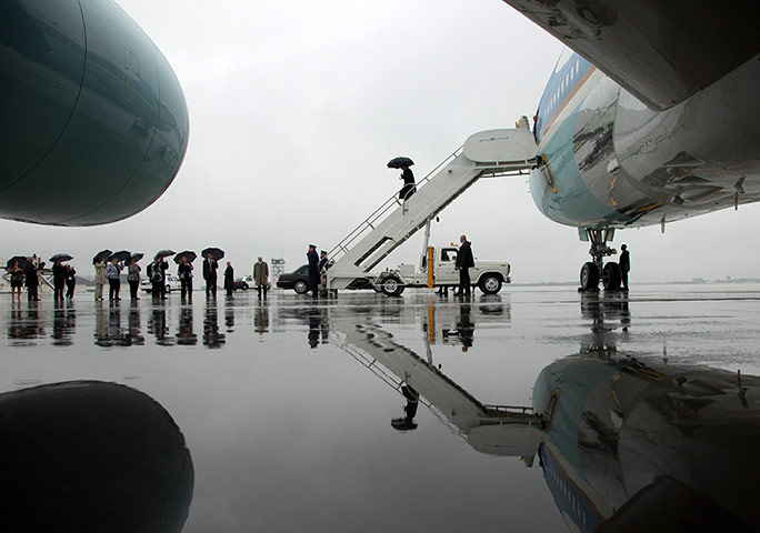 24 hours: President Barack Obama arrives on Air Force One in the rain at Cleveland Hopkins international airport, USA