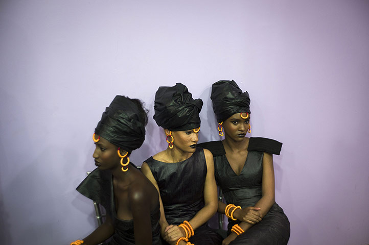 24 hours: Models wearing Adama Paris creations wait backstage before the Black Fashion Week show in Paris, France