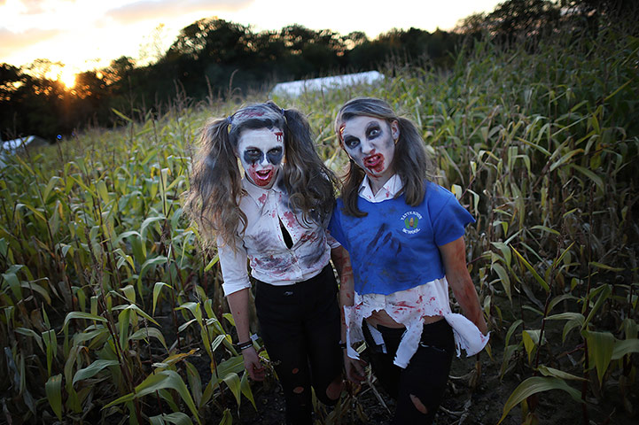 Shocktober: Zombie school girls stand in a corn field at Tulley's Farm