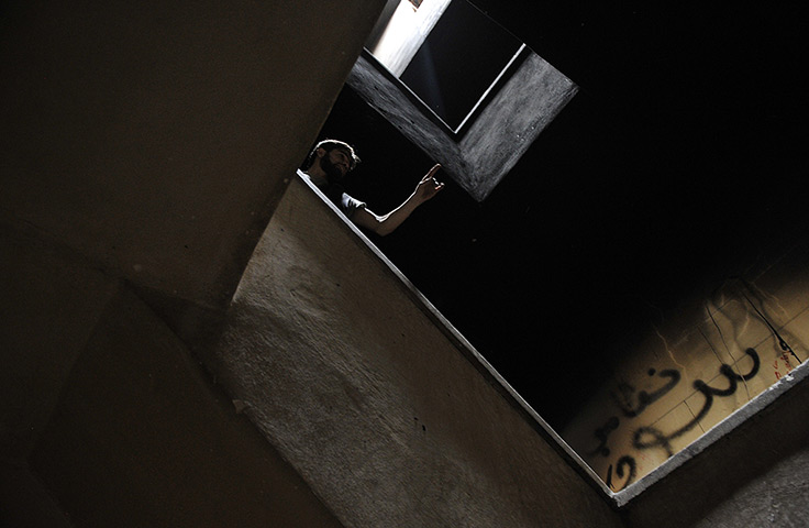 24 hours in pictures: A rebel fighter in Aleppo, Syria