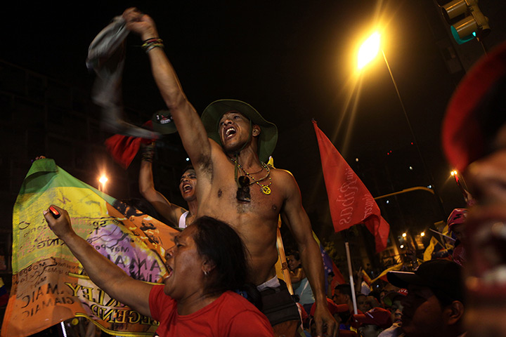 Venezuela elections: Supporters of  President Hugo Chavez celebrate at the Miraflores palace