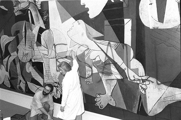 Defaced art: New York City's Museum of Modern Art employees clean paint off Guernica