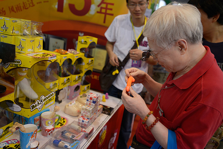China Sex expo: An elderly gentleman inspects sex toys