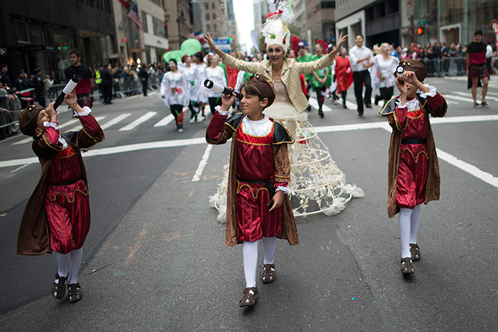 24 hours in pictures: Boys dressed as Italian explorer Christopher Columbus march