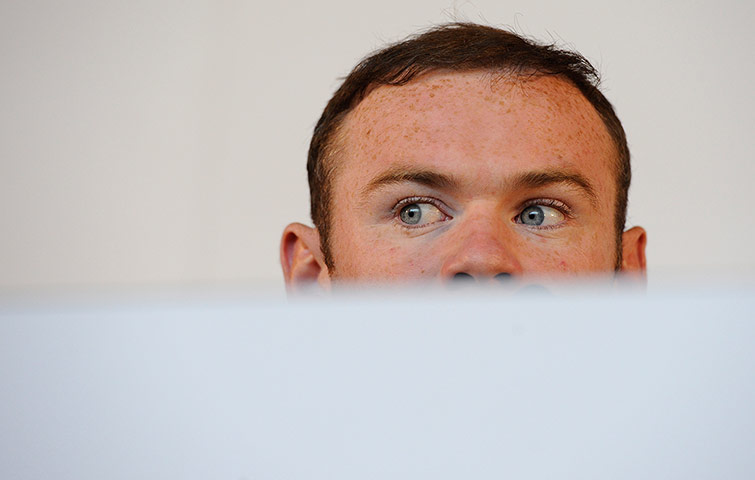 St Georges: Wayne Rooney looks sheepish during his press conference