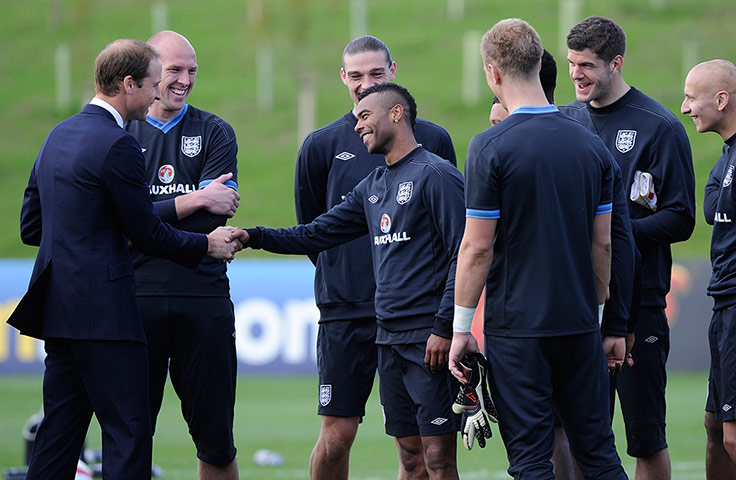 St Georges: Prince William shares a joke and handshake with Ashley Cole.