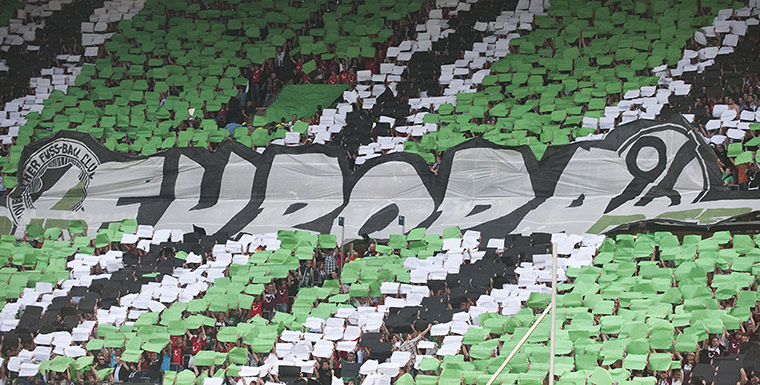 Tifo: Hanover fans display a giant Europa 96 sign