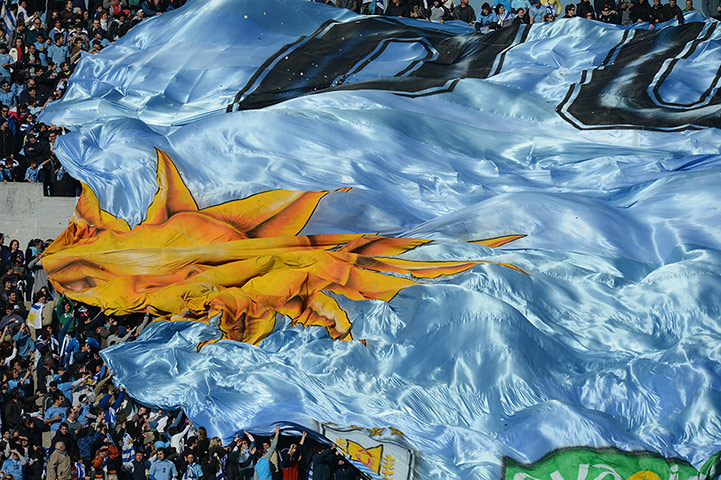 Tifo: Fans of Uruguay display a huge flag