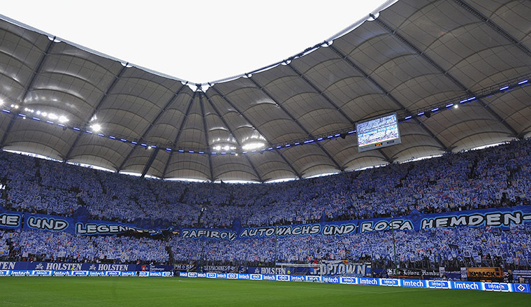 Tifo: Fans of Hamburg hold banners celebrating 125 years of their club