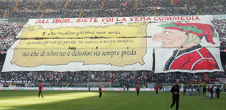 Tifo: AC Milan's fans hold a banner against Inter Milan's fans