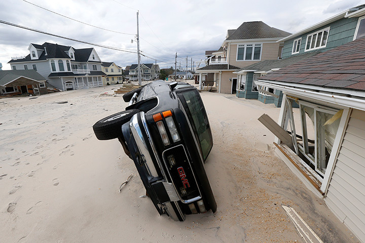 24 hours: Seaside Heights, New Jersey, USA: A vehicle lies on its side 