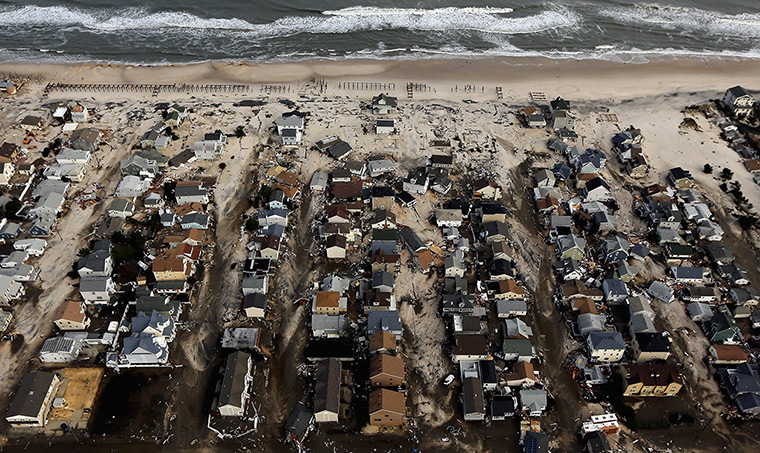 From the agencies: Homes sit in ruin next to the Atlantic Ocean in Seaside Heights, New Jersey