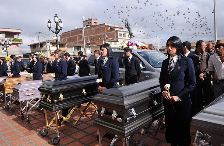 24 hours: The coffins of slain farm workers