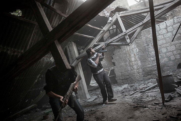 20 Photos: In Aleppo, a rebel fighter awaits an attack by loyalists to President Assad