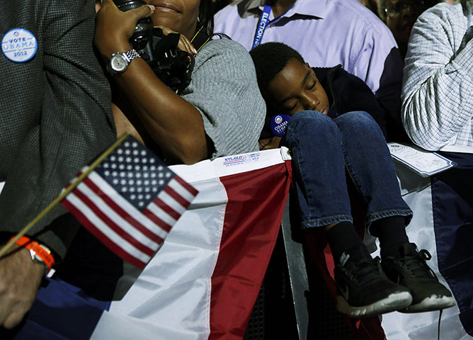 20 Photos: A child asleep at President Barack Obama's election night rally in Chicago