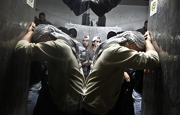 24 hours: Gaza City, Gaza Strip: A Palestinian relative cries in a hospital morgue