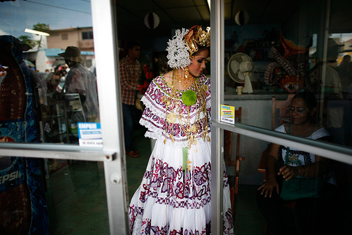 24 hours: La Chorrera, Panama: A woman wearing traditional clothing beofre a parade
