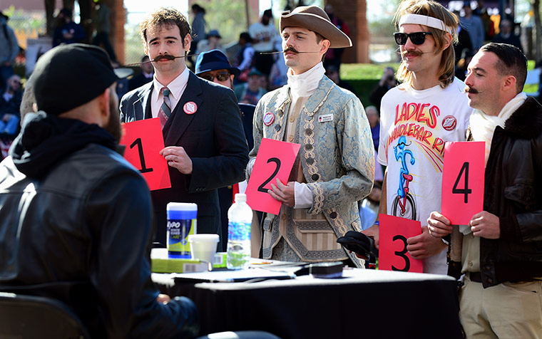 Moustache competition: Contestants and their moustaches face the judges