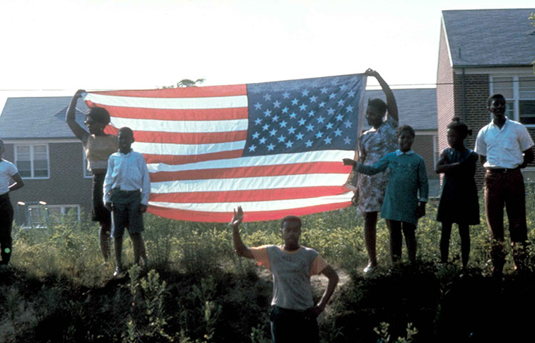 Robert F Kennedy: Mourners salute the funeral train carrying the body of Robert F Kennedy